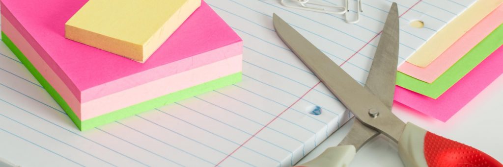 Desk with scissors and post it notes