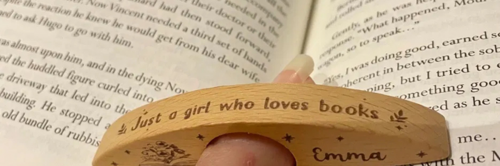 open book with thumb page holder